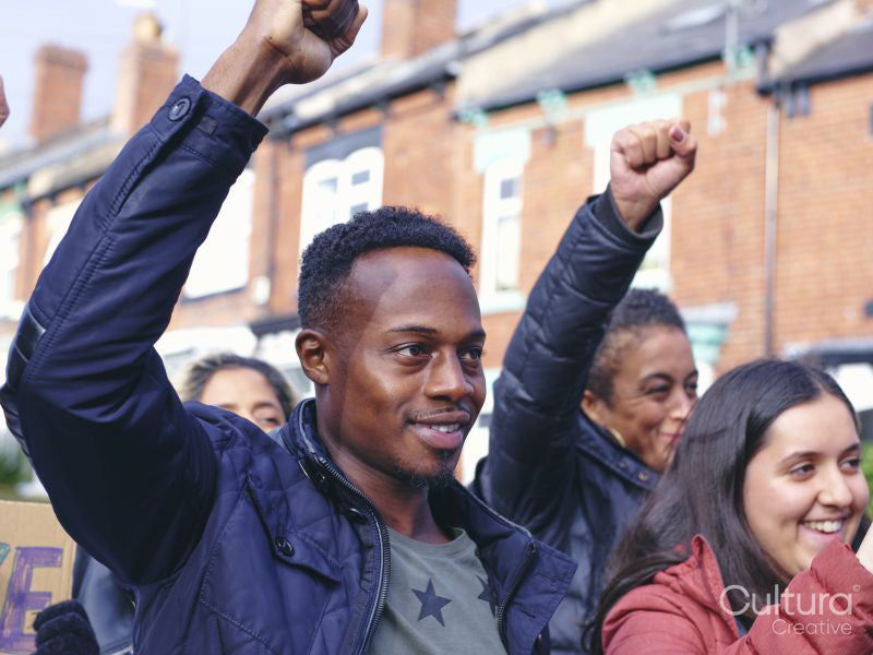 Protestors with hands raised