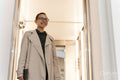 Non binary office worker walking in hallway