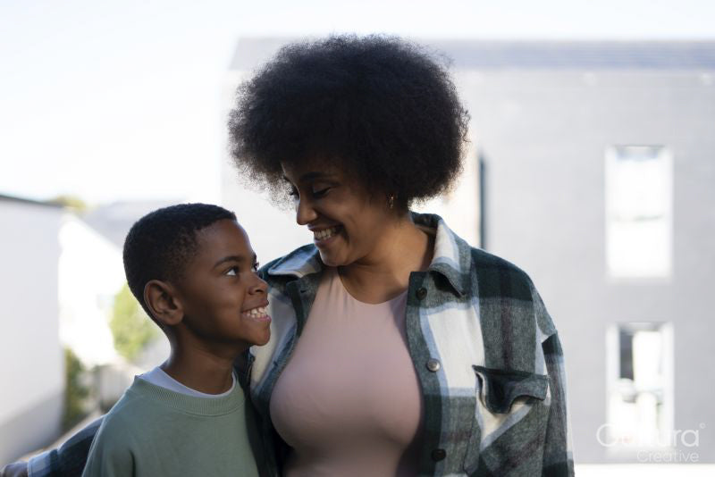 Mother and son smiling to each other
