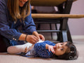 Mother caring for daughter with feeding tube