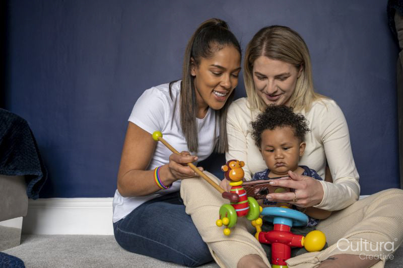 Mothers playing with baby son