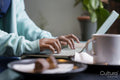 Female student using laptop while studying