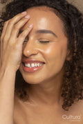 Close-up of smiling woman with eyes closed