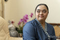 Portrait of young woman with down syndrome at home