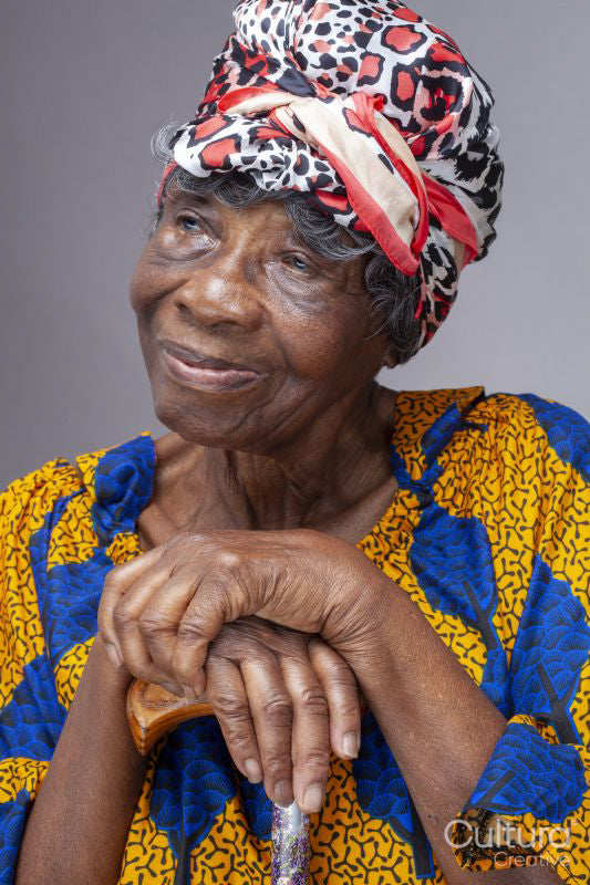 Studio shot of senior woman wearing headscarf