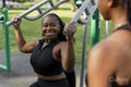 Young women exercising in outdoor gym