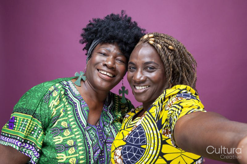 Studio portrait of mature sisters
