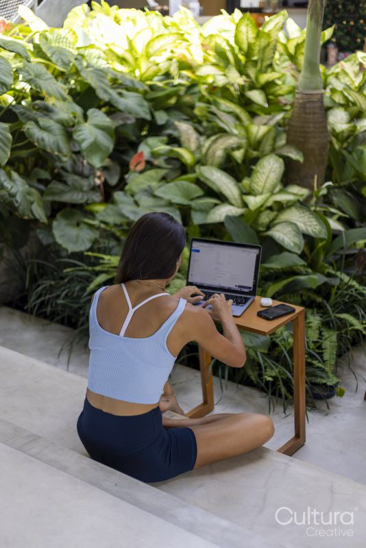 Woman sitting in hotel lounge and using laptop