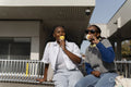 Young female friends eating ice cream
