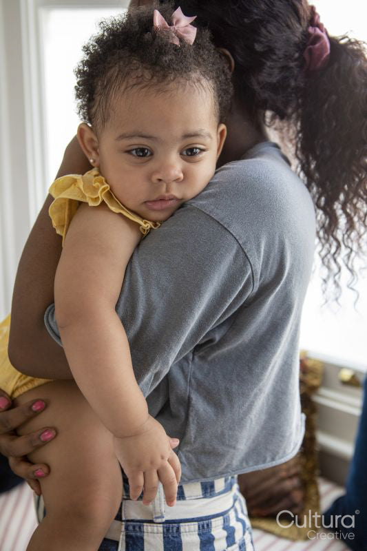 Mother with baby daughter at home
