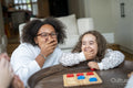 Sisters laughing at home