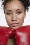Close-up of athletic woman in with boxing gloves