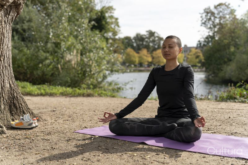 Woman meditating in park