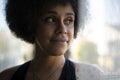 Smiling woman with curly hair
