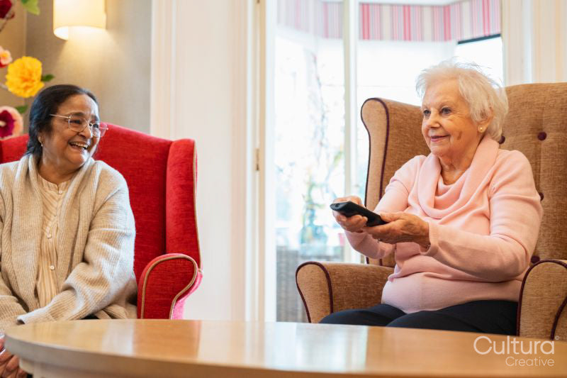 Senior people watching tv in nursing home