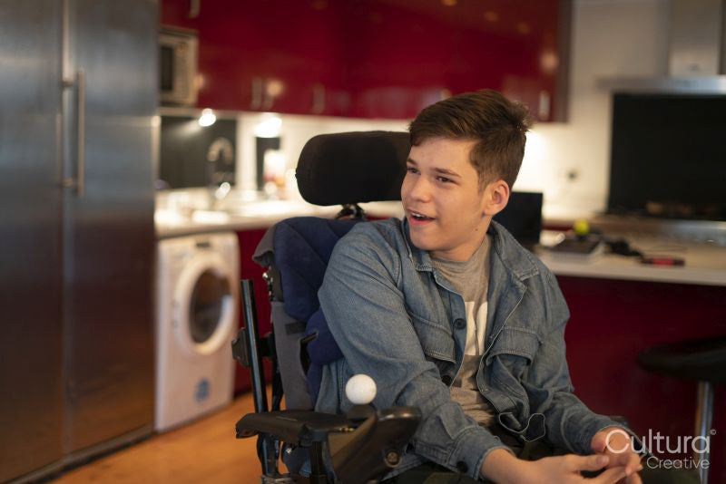 Portrait of teenage boy with cerebral palsy