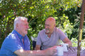 Senior male couple relaxing in garden