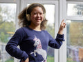 Portrait of smiling girl with Down Syndrome with headphones