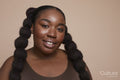 Studio portrait of young woman with braided hair