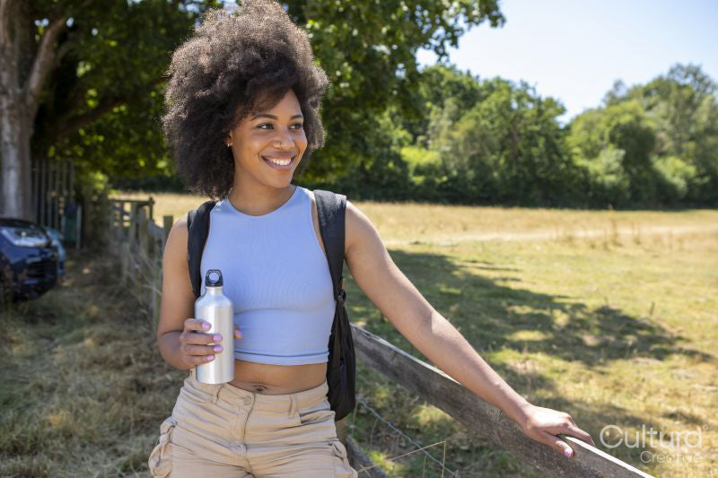 Portrait of young woman hiking in countryside