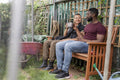 Smiling couple relaxing in urban garden