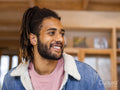 Portrait of young man with dreadlocks