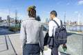 Two businessmen walking in business district