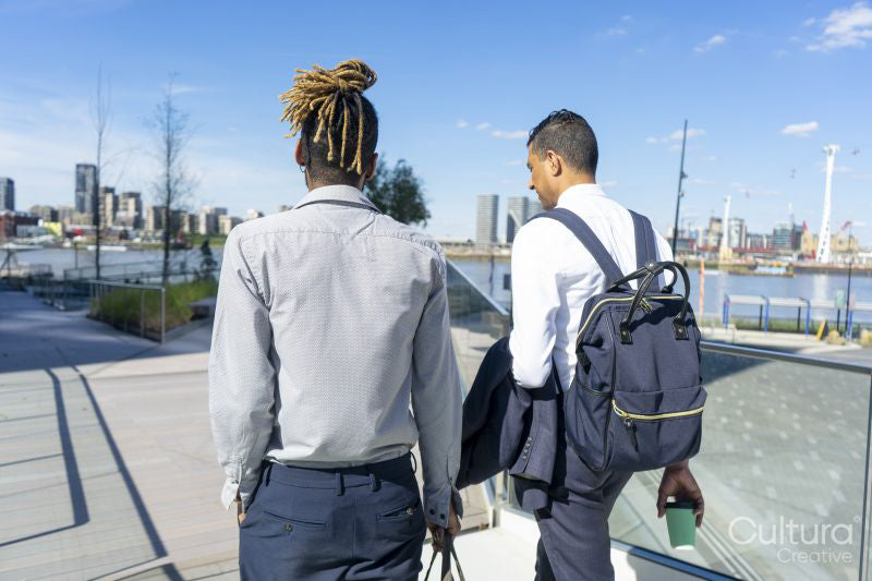 Two businessmen walking in business district