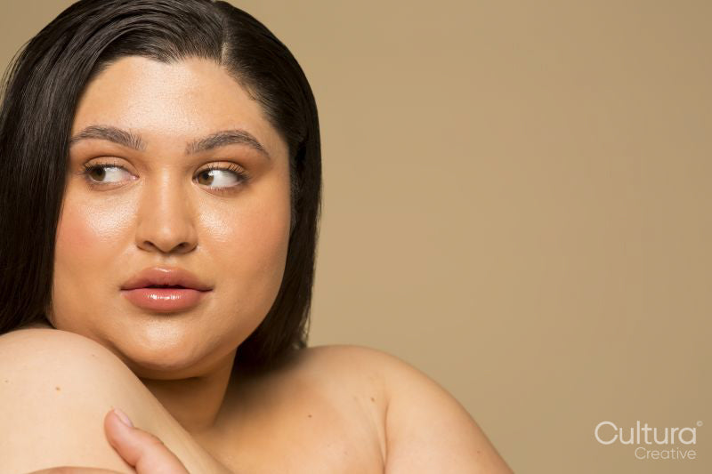 Studio portrait of shirtless young woman