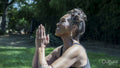 Senior woman meditating outdoors