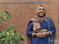 Portrait of woman wearing hijab in backyard