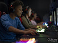 Friends playing video games in gaming club