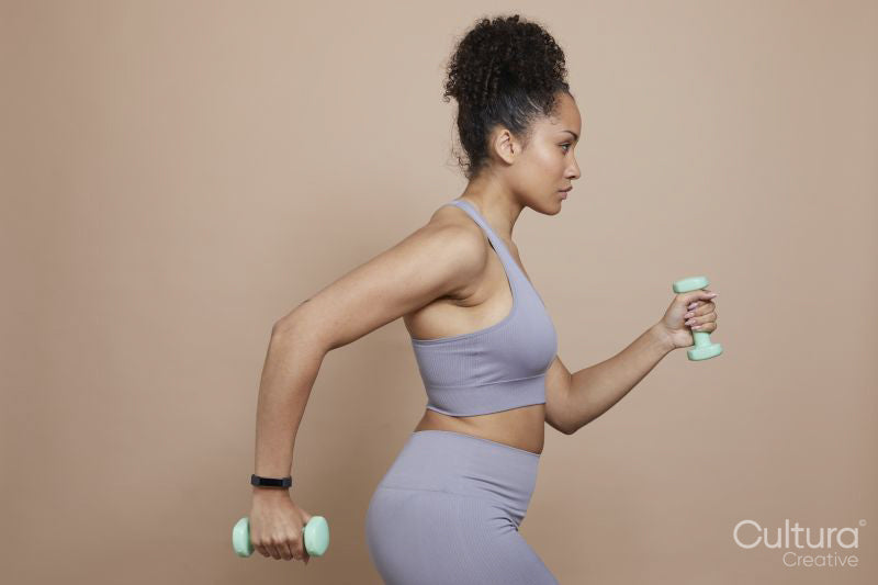 Woman exercising with dumbbells