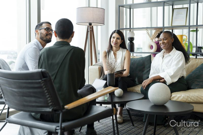 Business people having meeting in office lobby