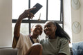 couple taking selfie at home