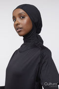 Studio portrait of young woman in hijab