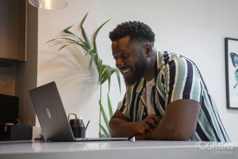 Man using laptop in living room