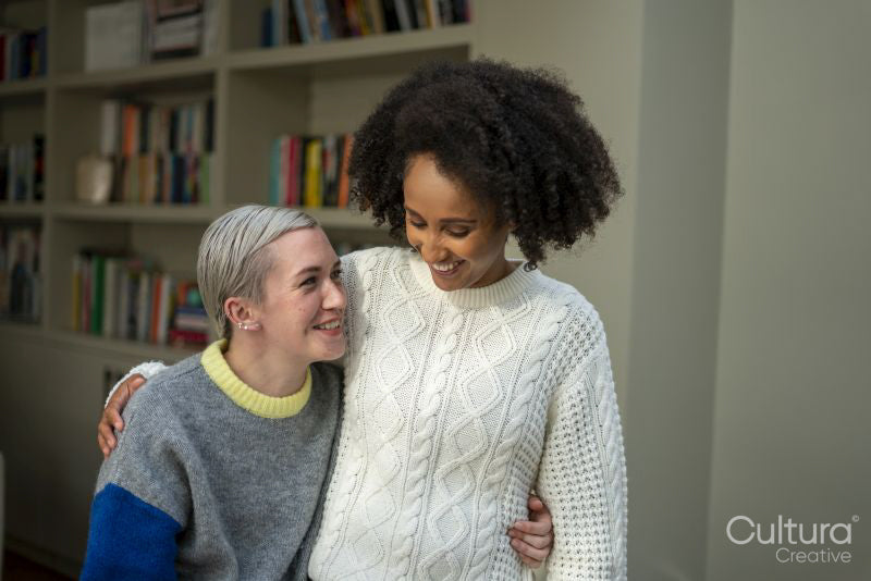 Smiling couple embracing at home