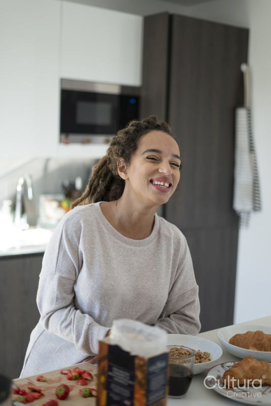 Woman preparing breakfast in kitchen