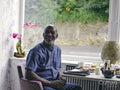 Smiling man sitting at hotel breakfast table