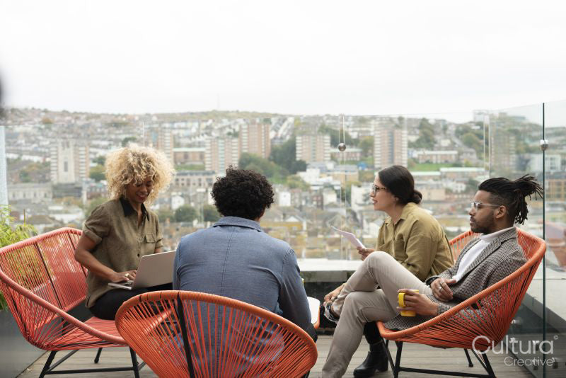 Creative professionals having meeting on office terrace