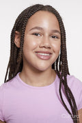 Studio portrait of smiling girl with braided hair