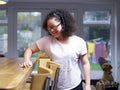 Girl with Down syndrome cleaning table