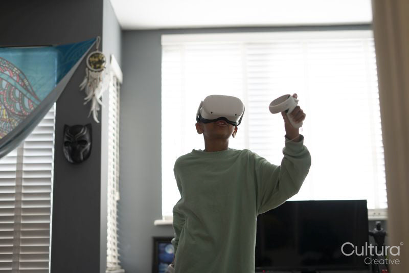 Boy using virtual reality headset at home