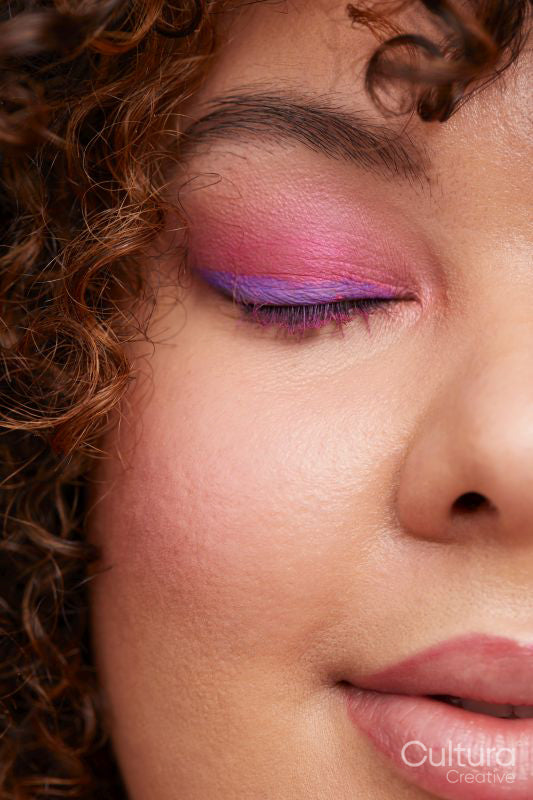 Brunette woman with pink eye shadows