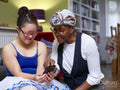Mother and daughter with Down syndrome using smart phone