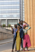 Fashion portrait of four people in urban street