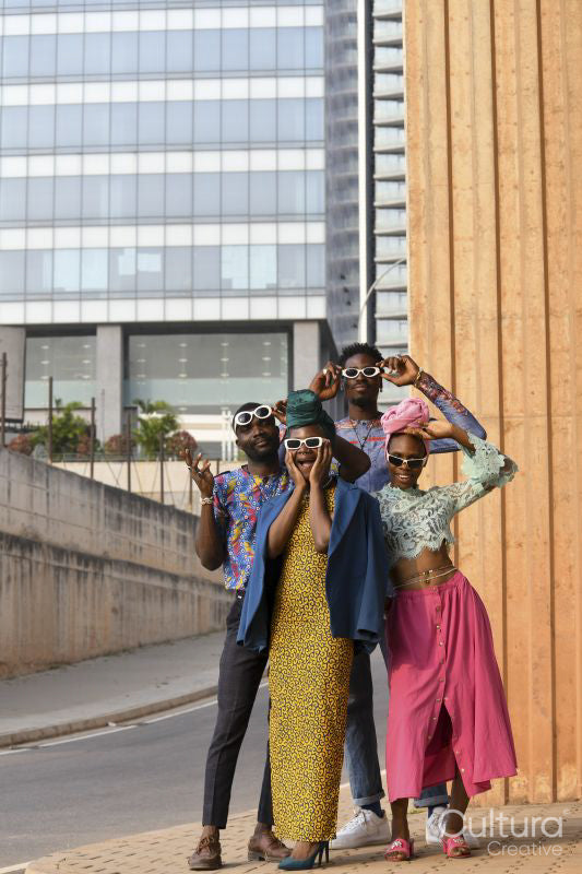 Fashion portrait of four people in urban street