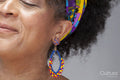 Mature woman wearing colorful earring