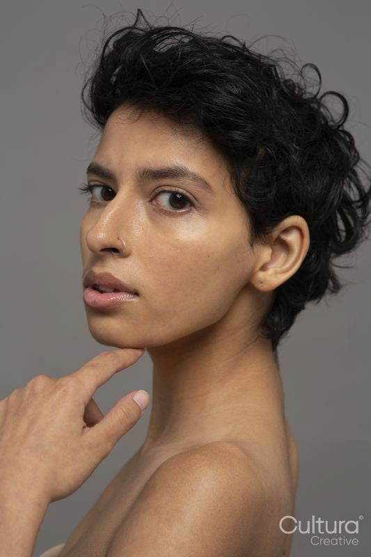 Studio portrait of shirtless woman